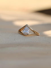 Pear cut lab grown diamond split shank engagement ring, 1.0 to 3.0 carats, set in elegant prong design on polished gold band