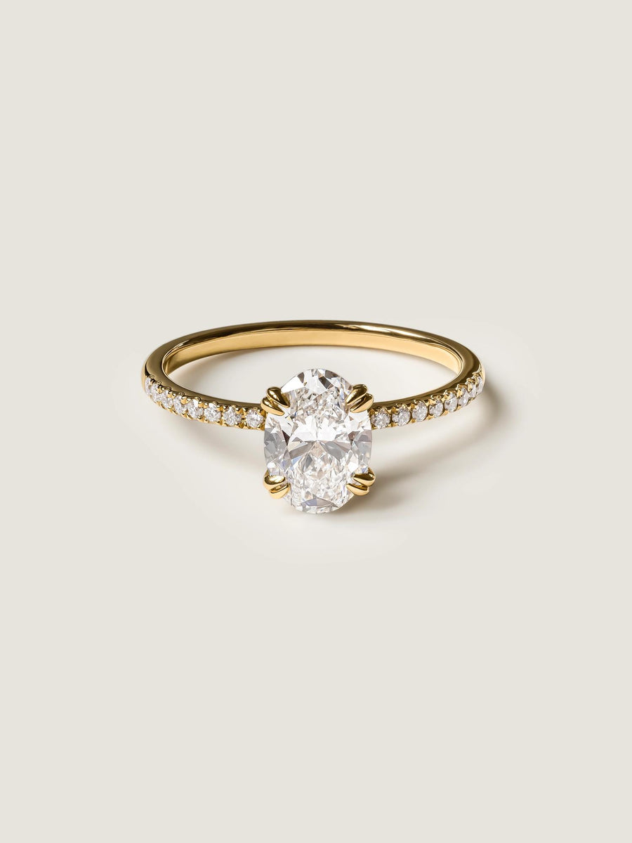 Oval cut lab grown diamond pavé engagement ring, 1.20 to 3.20 carats, with side stones set in a polished gold band