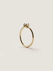 0.20 carat pear cut lab grown diamond solitaire engagement ring in prong setting with polished gold band