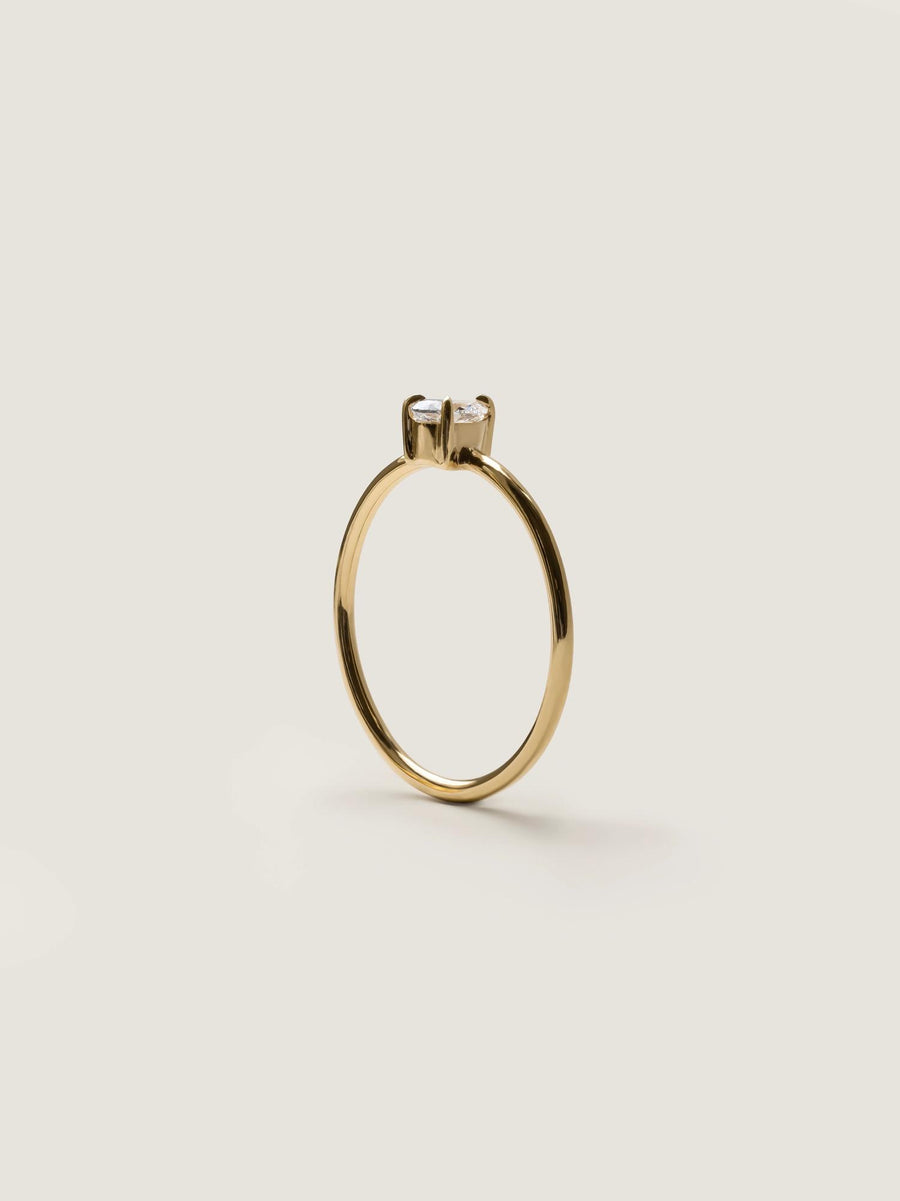 0.20 carat pear cut lab grown diamond solitaire engagement ring in prong setting with polished gold band