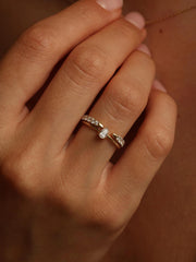 0.20 carat pear cut lab grown diamond solitaire engagement ring in prong setting with polished gold band