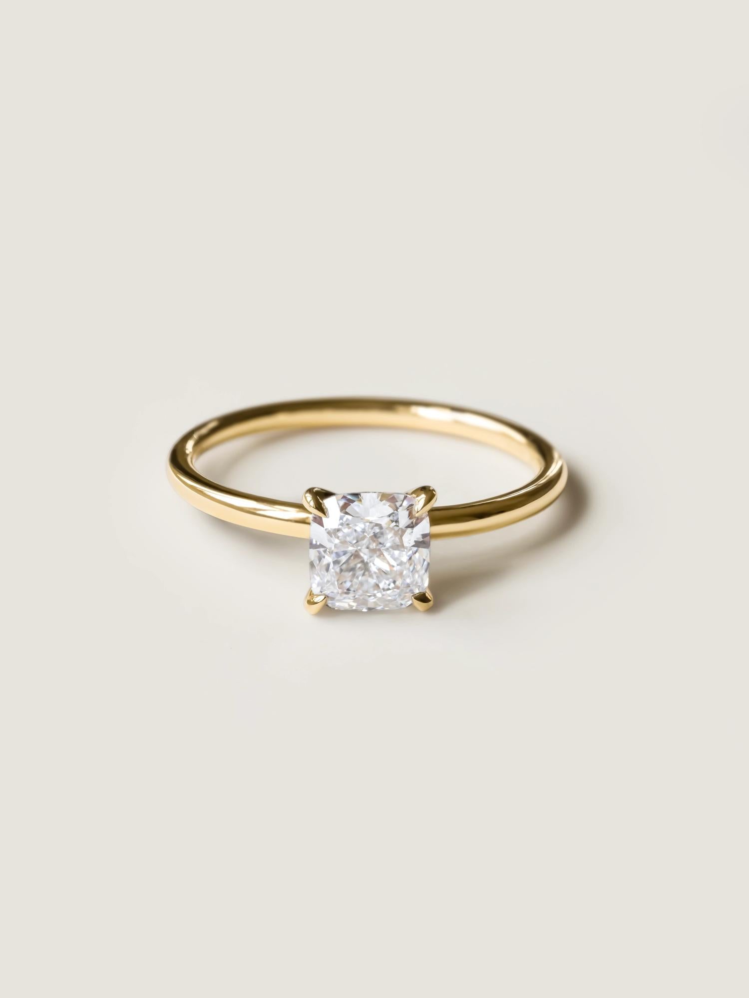 Cushion cut lab grown diamond solitaire engagement ring, 1.0 to 3.0 carats, set in a classic prong design on polished gold band