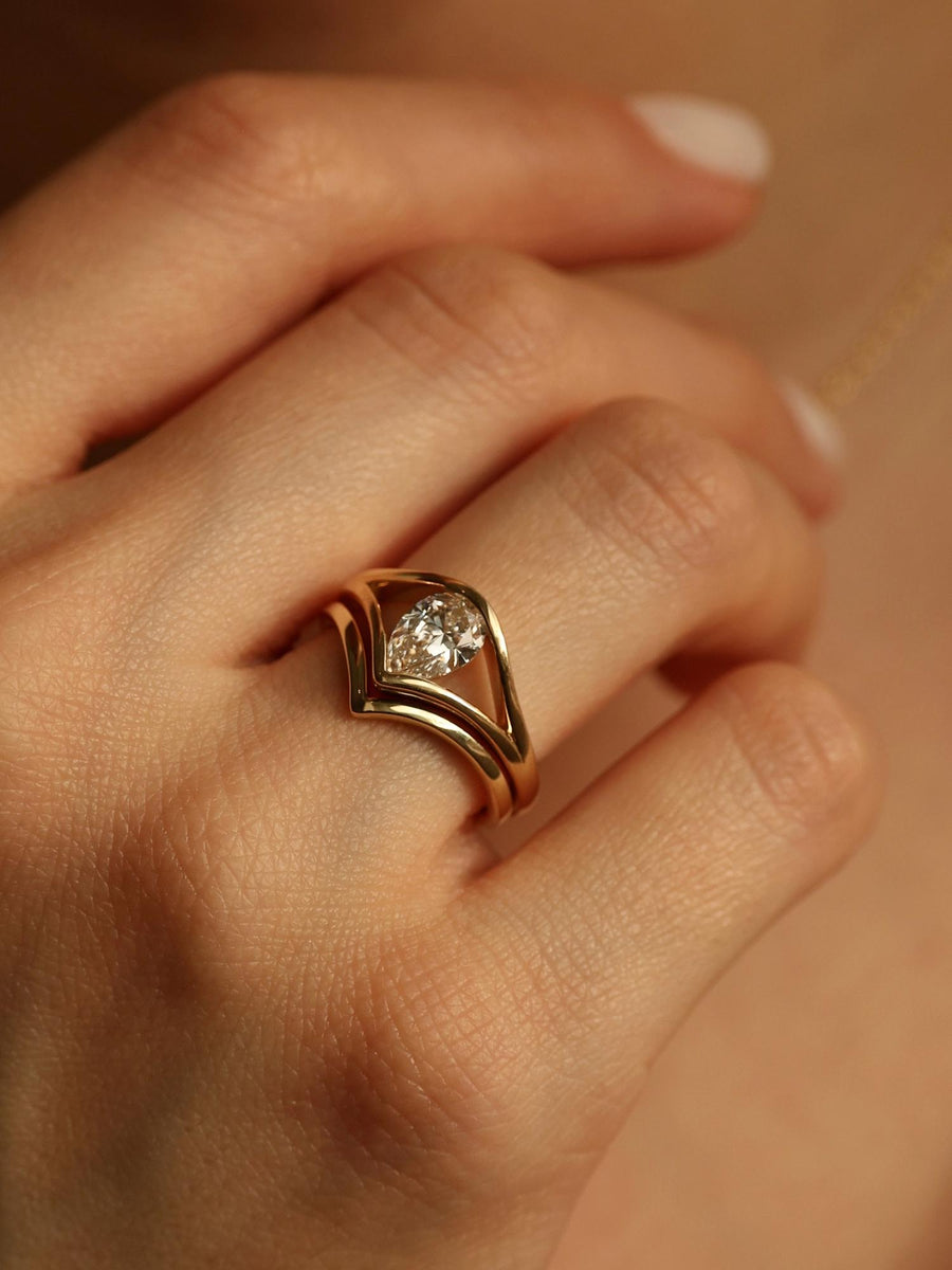 Pear cut lab grown diamond split shank engagement ring, 1.0 to 3.0 carats, set in elegant prong design on polished gold band