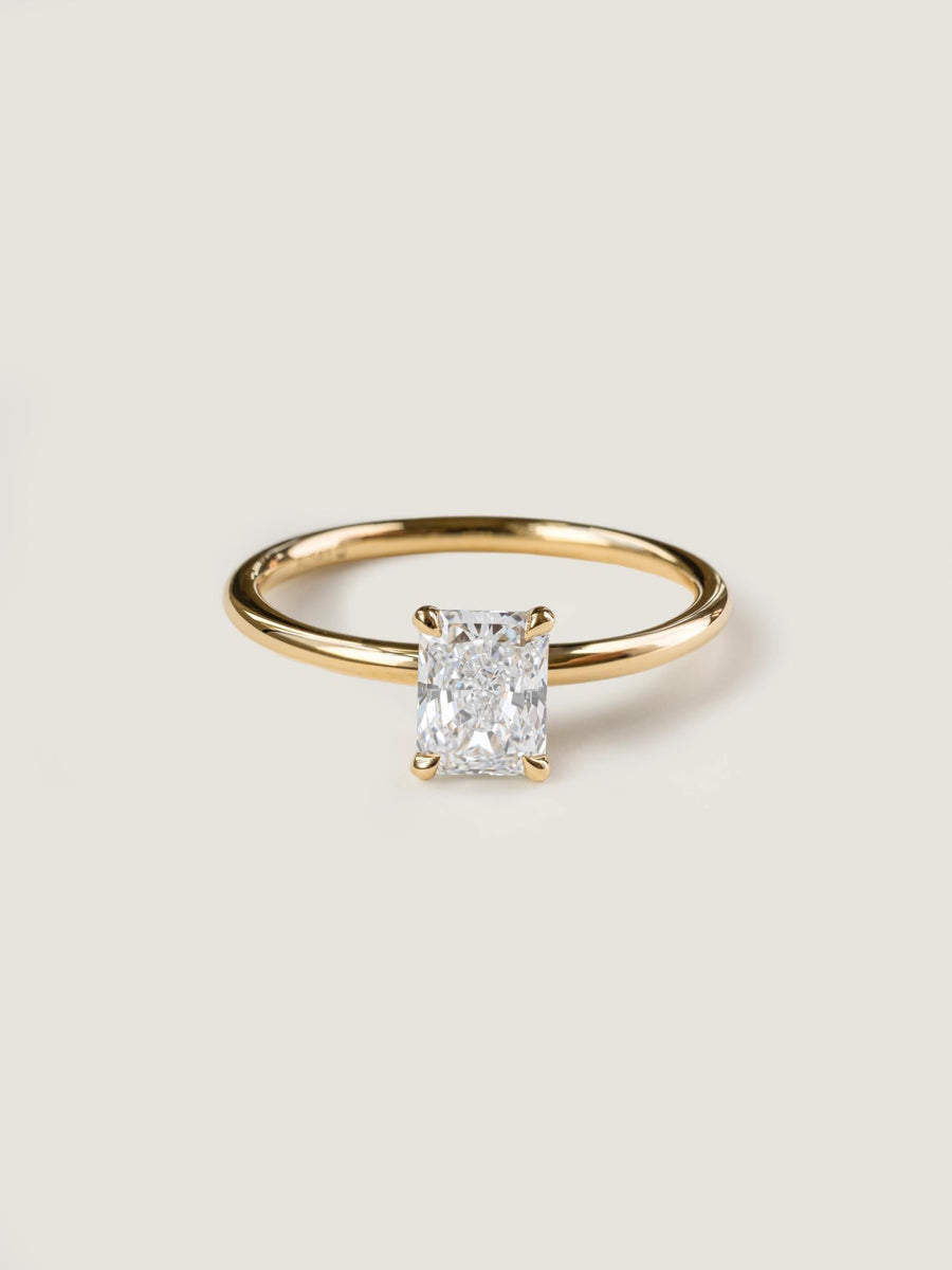 Radiant cut lab grown diamond solitaire engagement ring, 0.90 to 2.50 carats, set in classic prong design on polished gold band

