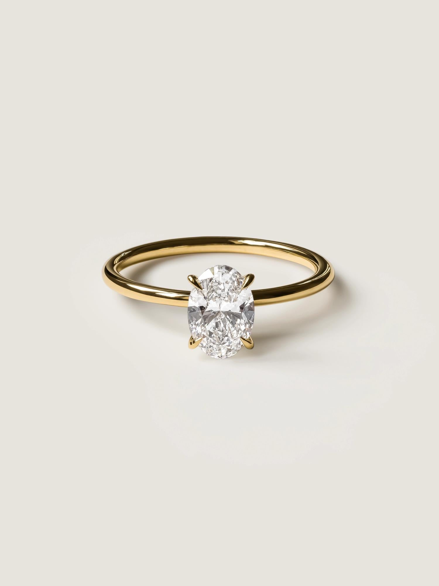 Oval cut lab grown diamond solitaire engagement ring, 1.0 to 3.0 carats, set in timeless prong design on polished gold band