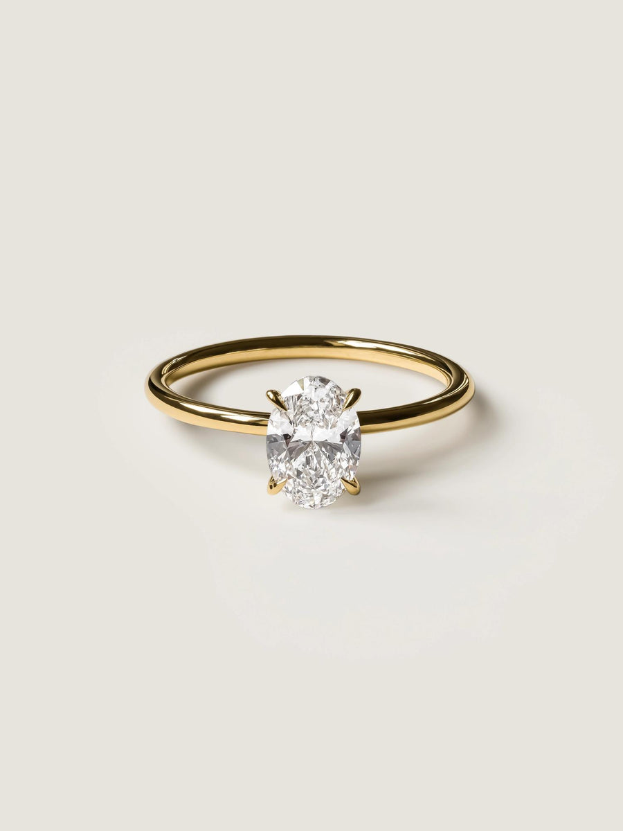 Oval cut lab grown diamond solitaire engagement ring, 1.0 to 3.0 carats, set in timeless prong design on polished gold band