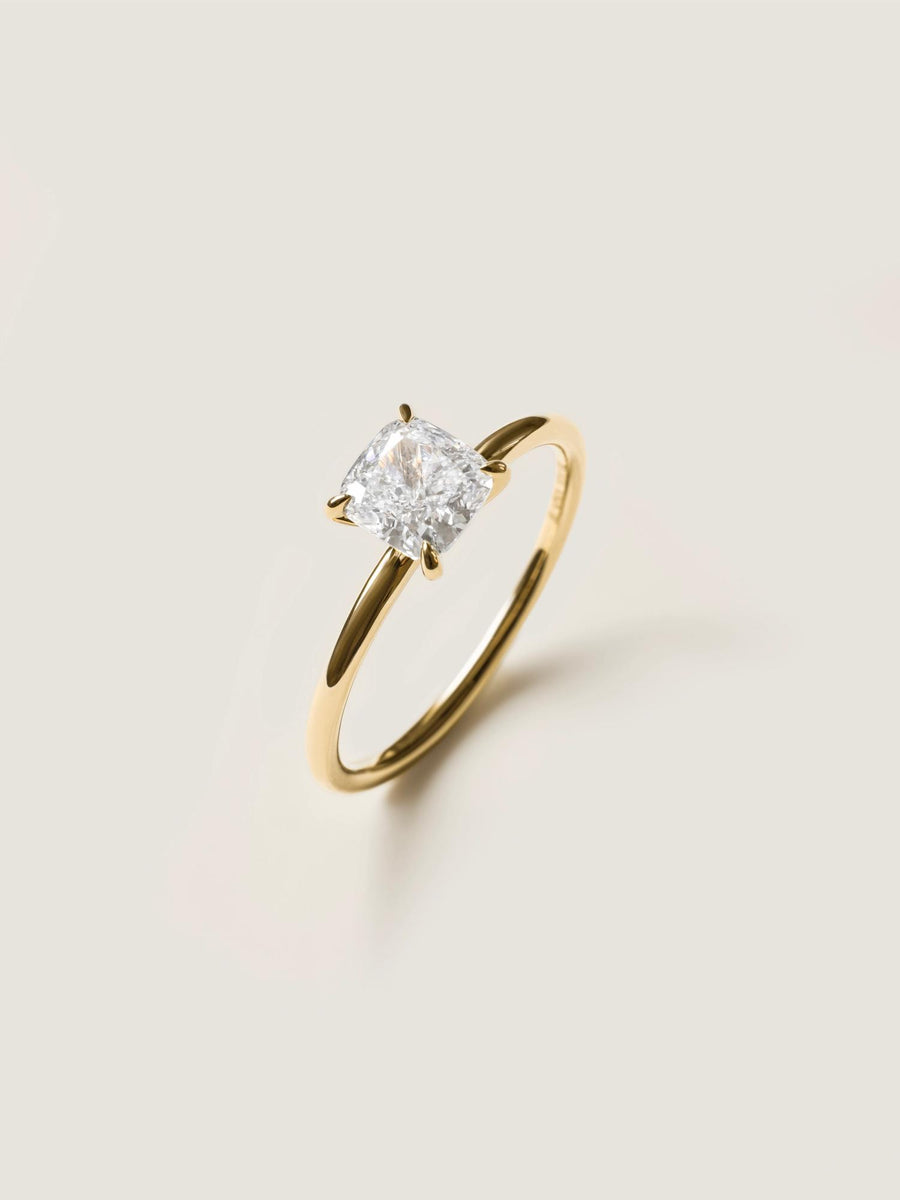 Cushion cut lab grown diamond solitaire engagement ring, 1.0 to 3.0 carats, set in a classic prong design on polished gold band