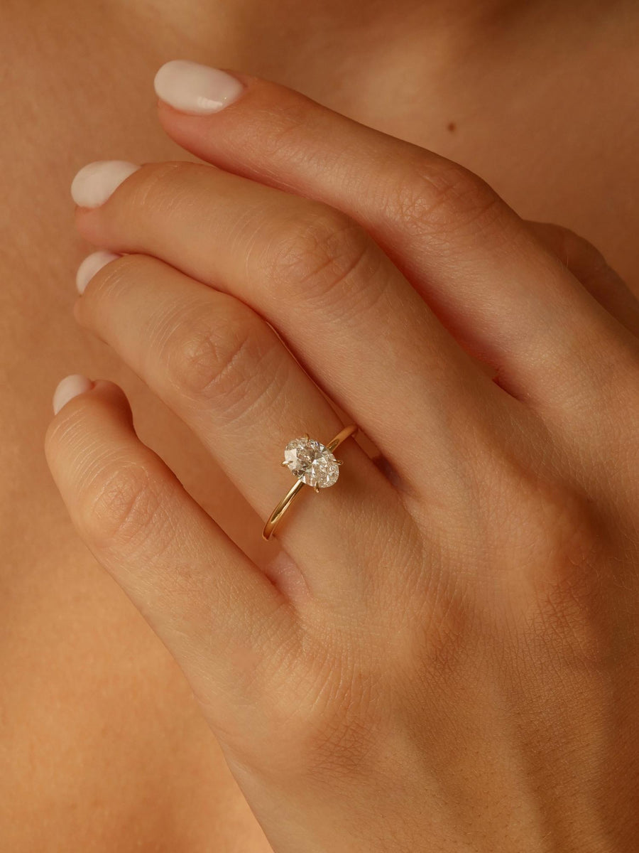 Oval cut lab grown diamond solitaire engagement ring, 1.0 to 3.0 carats, set in timeless prong design on polished gold band