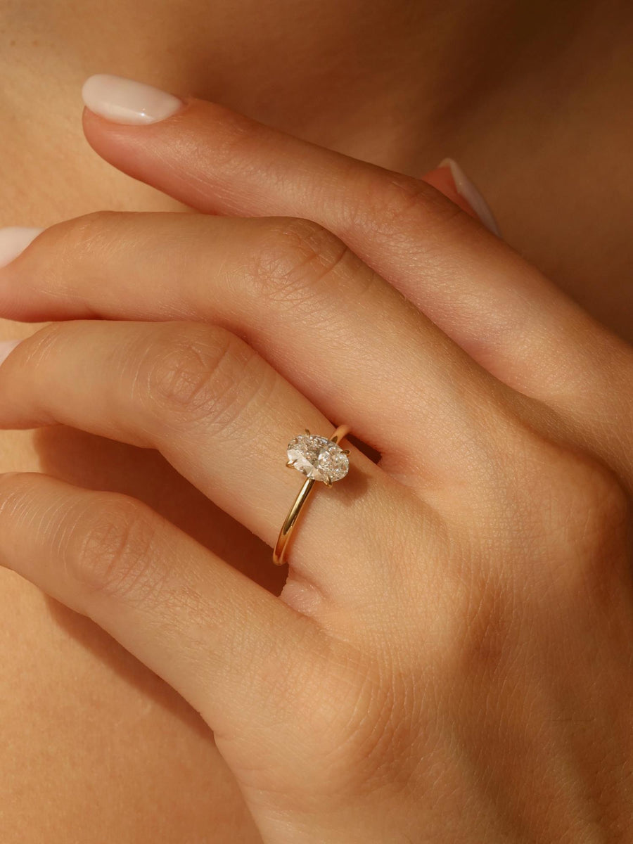Oval cut lab grown diamond solitaire engagement ring, 1.0 to 3.0 carats, set in timeless prong design on polished gold band