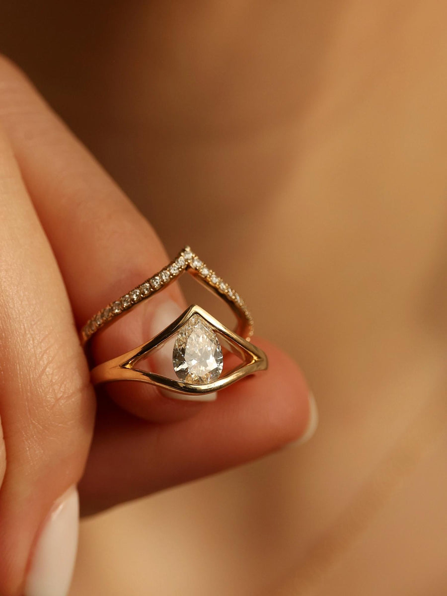 Pear cut lab grown diamond split shank engagement ring, 1.0 to 3.0 carats, set in elegant prong design on polished gold band