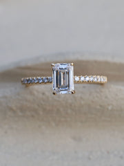Emerald cut lab grown diamond pavé engagement ring, 0.90 to 2.50 carats, with side stones in a sleek prong setting on gold band