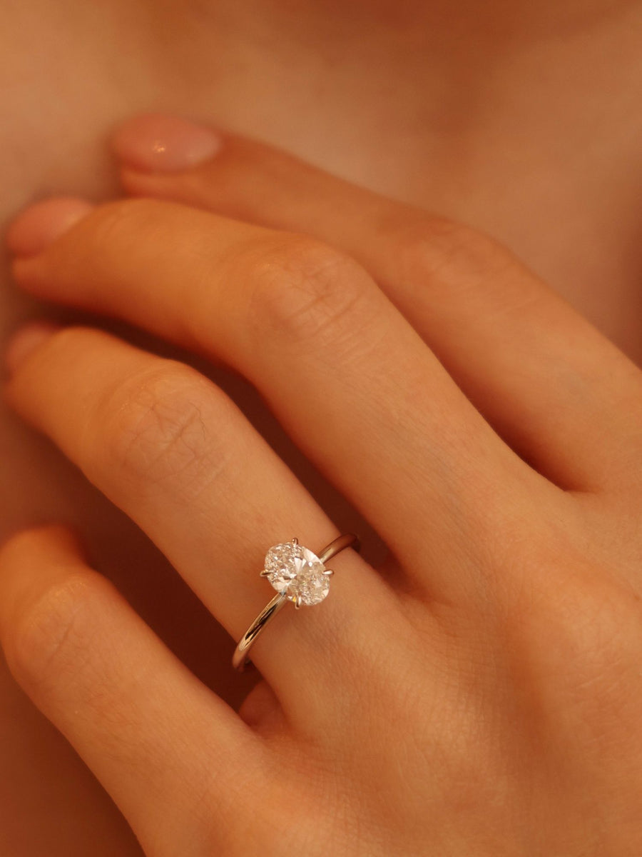 Oval cut lab grown diamond solitaire engagement ring, 1.0 to 3.0 carats, set in timeless prong design on polished gold band