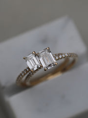 Emerald cut lab grown diamond pavé engagement ring, 0.90 to 2.50 carats, with side stones in a sleek prong setting on gold band