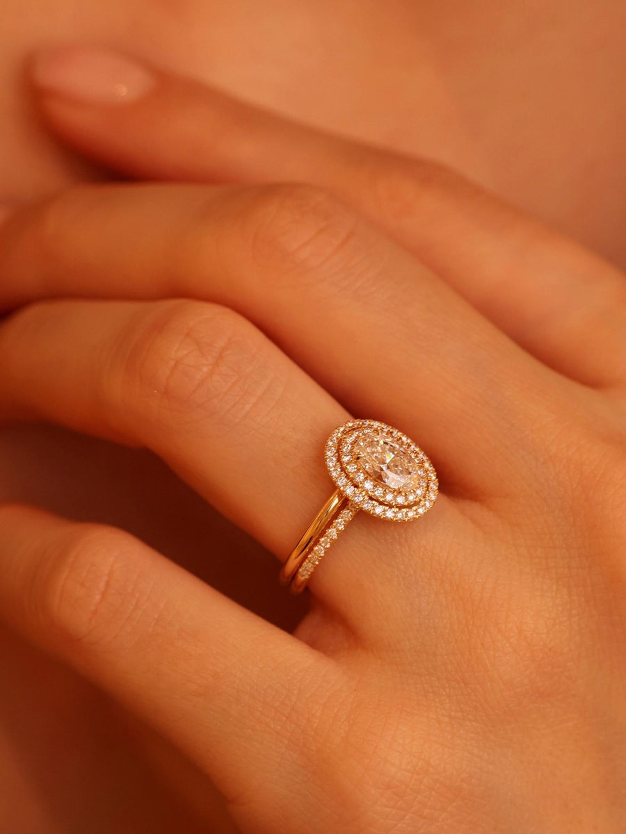 Oval cut lab grown diamond double halo and pavé engagement ring, 0.95 to 2.95 carats, set in elegant prong design on gold band