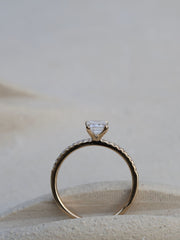 Emerald cut lab grown diamond pavé engagement ring, 0.90 to 2.50 carats, with side stones in a sleek prong setting on gold band
