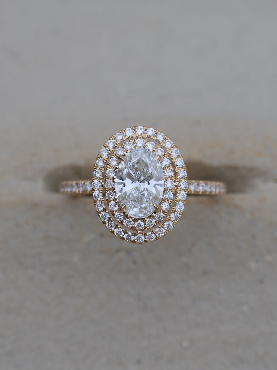 Oval cut lab grown diamond double halo and pavé engagement ring, 0.95 to 2.95 carats, set in elegant prong design on gold band