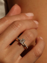 Emerald cut lab grown diamond pavé engagement ring, 0.90 to 2.50 carats, with side stones in a sleek prong setting on gold band