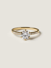 Round cut lab grown diamond pavé engagement ring, 1.01 to 3.01 carats, accented with side stones in a polished gold band