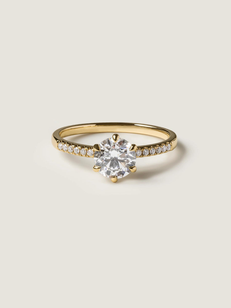 Round cut lab grown diamond pavé engagement ring, 1.01 to 3.01 carats, accented with side stones in a polished gold band
