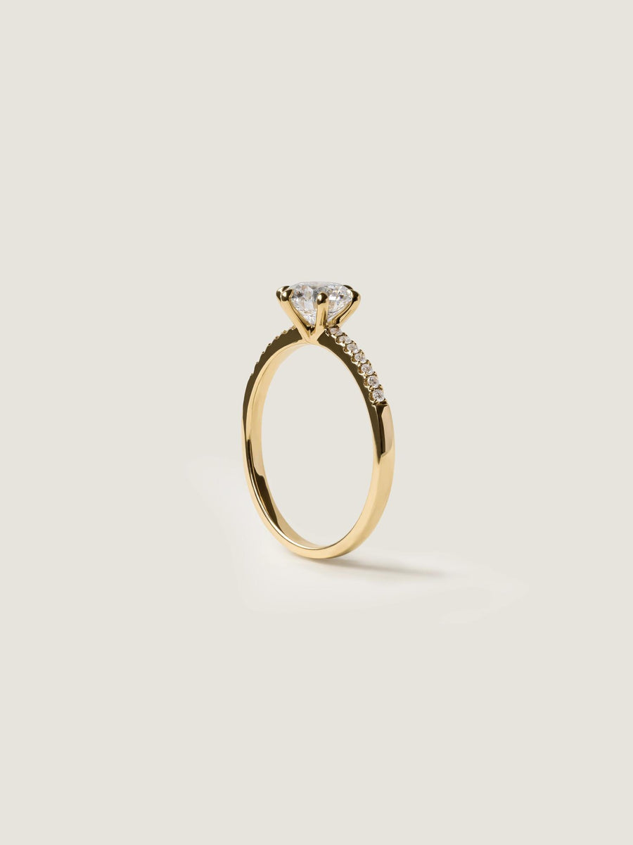 Round cut lab grown diamond pavé engagement ring, 1.01 to 3.01 carats, accented with side stones in a polished gold band