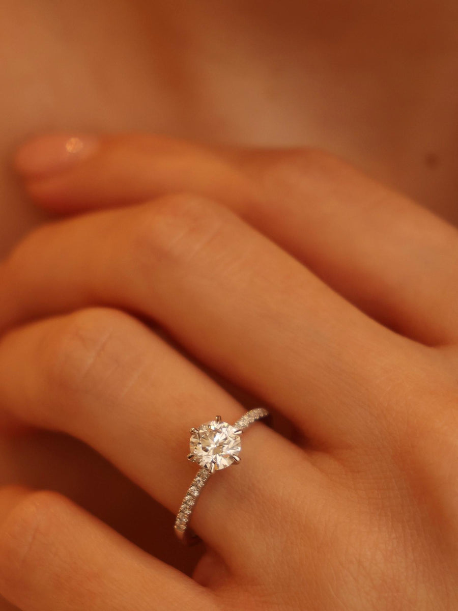 Round cut lab grown diamond pavé engagement ring, 1.01 to 3.01 carats, accented with side stones in a polished gold band