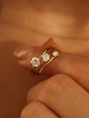 0.30 carat round cut lab grown diamond solitaire engagement ring in E/VS1 clarity, set in a sleek prong on gold band

