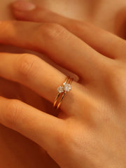 0.30 carat round cut lab grown diamond solitaire engagement ring in E/VS1 clarity, set in a sleek prong on gold band

