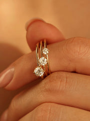 0.30 carat round cut lab grown diamond solitaire engagement ring in E/VS1 clarity, set in a sleek prong on gold band
