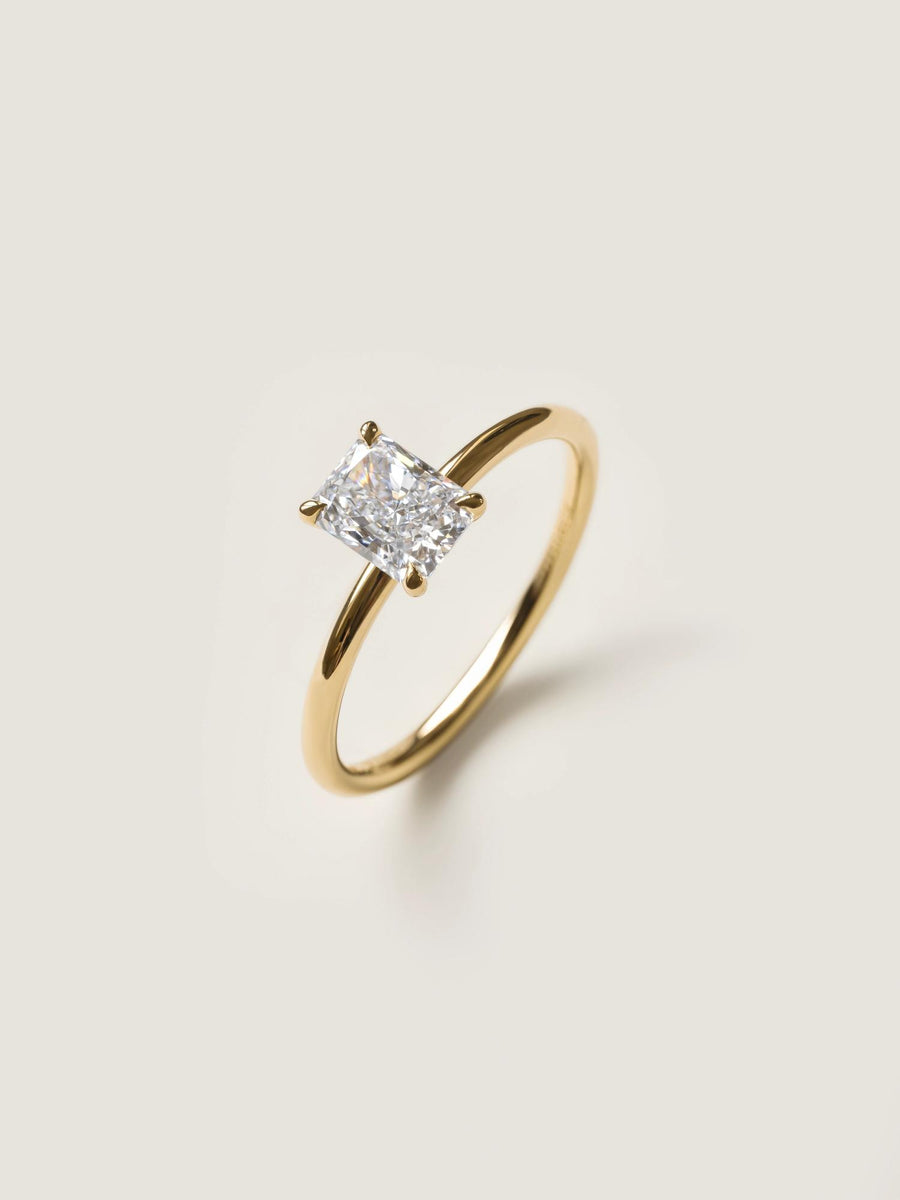 Radiant cut lab grown diamond solitaire engagement ring, 0.90 to 2.50 carats, set in classic prong design on polished gold band

