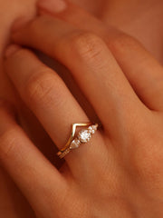 Round cut lab grown diamond three stone engagement ring, 0.50 to 2.50 carats, set in classic prong design on polished gold band