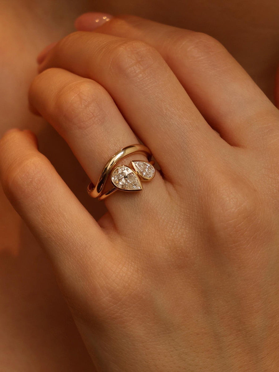 Two stone pear cut lab grown diamond engagement ring, 1.5 carats total, E/VS1 clarity, set in polished gold band