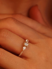 Round cut lab grown diamond three stone engagement ring, 0.50 to 2.50 carats, set in classic prong design on polished gold band