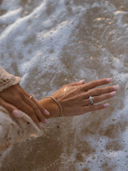 Round cut lab grown diamond three stone engagement ring, 0.50 to 2.50 carats, set in classic prong design on polished gold band