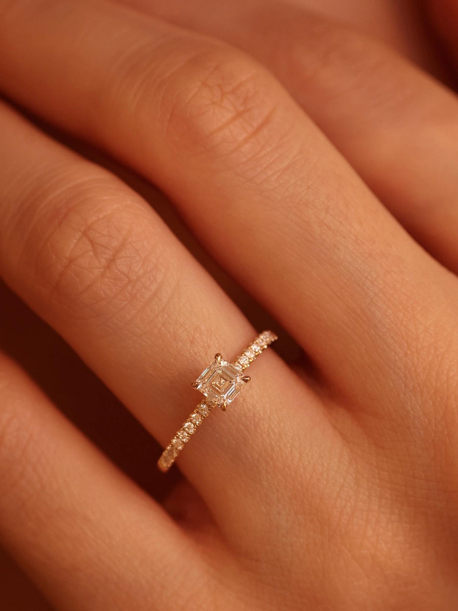 Asscher cut lab grown diamond pavé engagement ring, 0.50 to 2.50 carats, with side stones set in a polished gold band