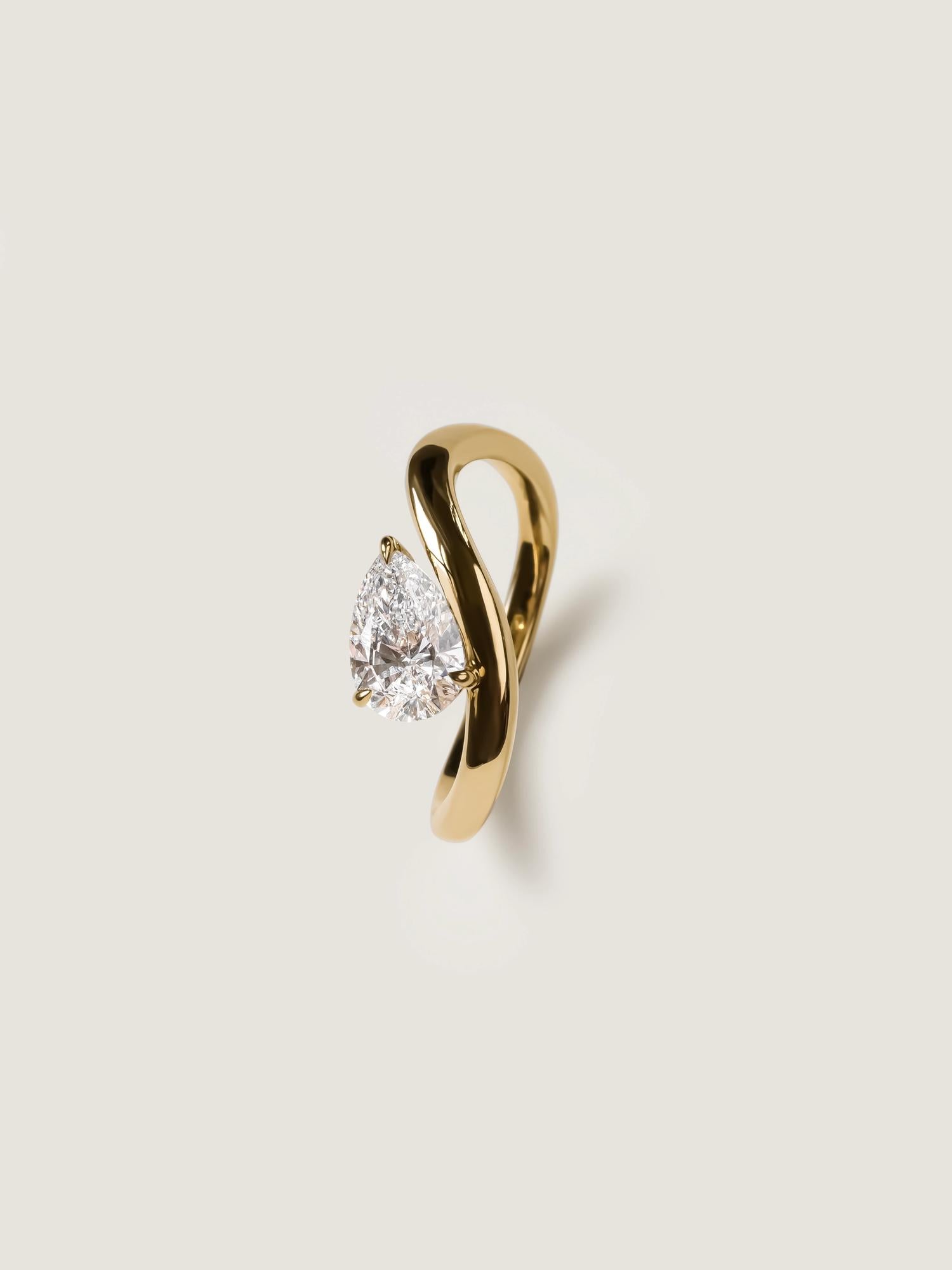 Pear cut lab grown diamond engagement ring, 1.0 to 3.0 carats, in a unique designer-inspired setting on polished gold band