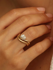 Pear cut lab grown diamond engagement ring, 1.0 to 3.0 carats, in a unique designer-inspired setting on polished gold band