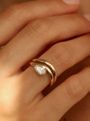 Pear cut lab grown diamond engagement ring, 1.0 to 3.0 carats, in a unique designer-inspired setting on polished gold band