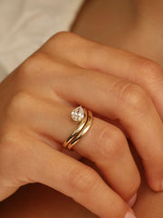 Pear cut lab grown diamond engagement ring, 1.0 to 3.0 carats, in a unique designer-inspired setting on polished gold band