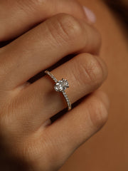 Oval cut lab grown diamond pavé engagement ring, 0.50 to 1.50 carats, with side stones in elegant prong setting on gold band