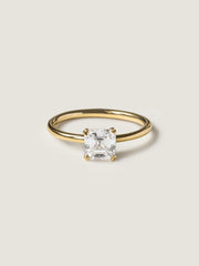 1.20 carat Asscher cut lab grown diamond solitaire engagement ring set in a classic prong design on polished gold band