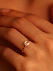 1.20 carat Asscher cut lab grown diamond solitaire engagement ring set in a classic prong design on polished gold band