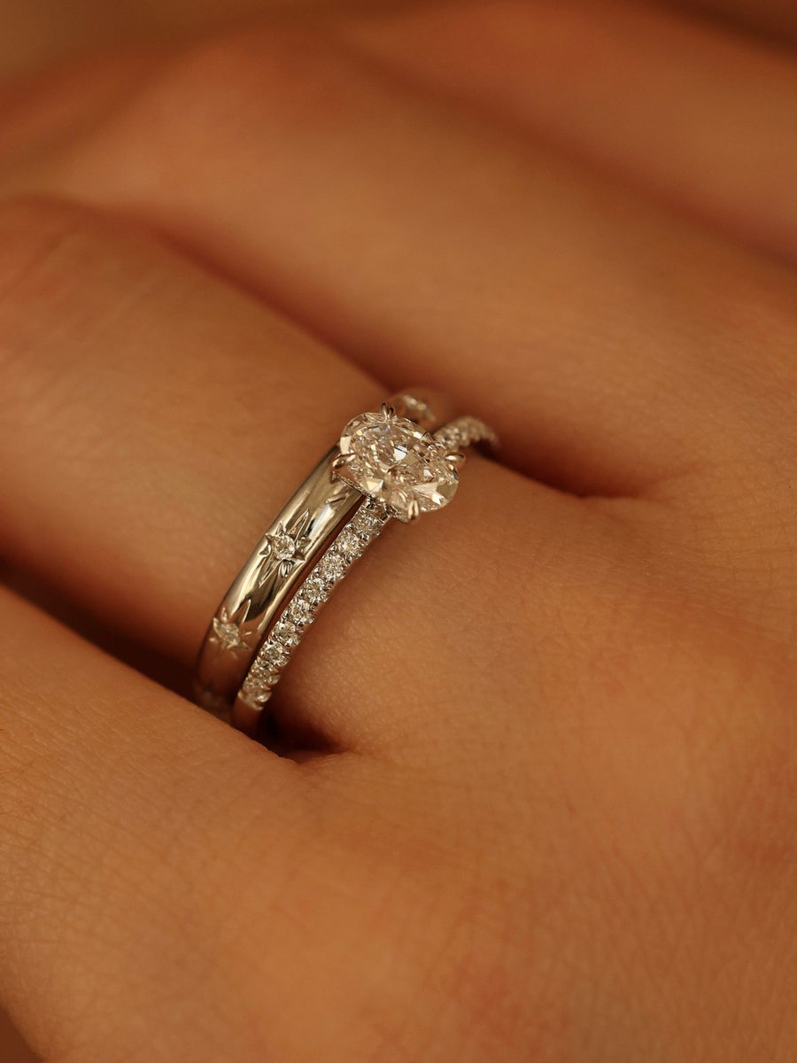 Oval cut lab grown diamond pavé engagement ring, 0.50 to 1.50 carats, with side stones in elegant prong setting on gold band