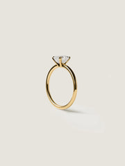 1.20 carat Asscher cut lab grown diamond solitaire engagement ring set in a classic prong design on polished gold band