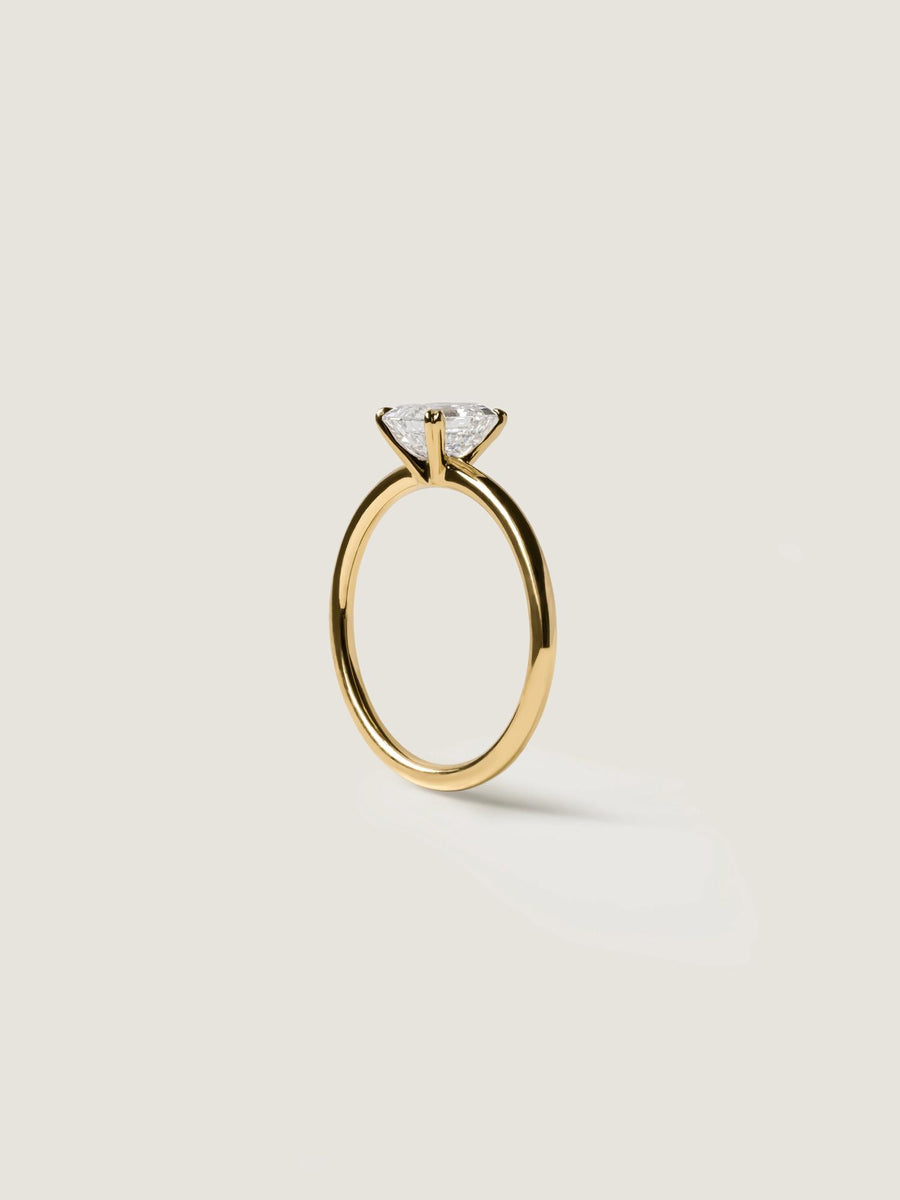 1.20 carat Asscher cut lab grown diamond solitaire engagement ring set in a classic prong design on polished gold band