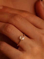 1.20 carat Asscher cut lab grown diamond solitaire engagement ring set in a classic prong design on polished gold band