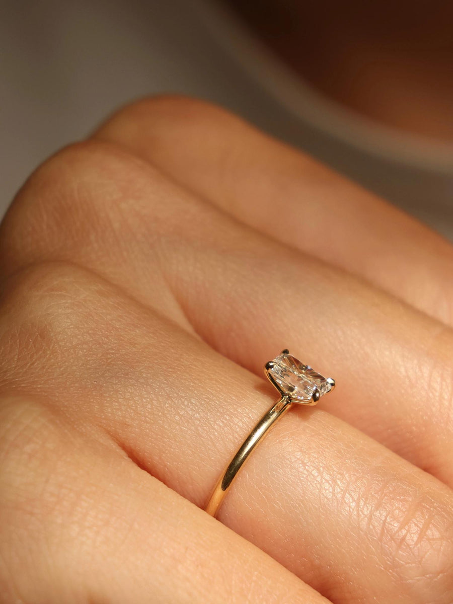 Radiant cut lab grown diamond solitaire engagement ring, 0.90 to 2.50 carats, set in classic prong design on polished gold band
