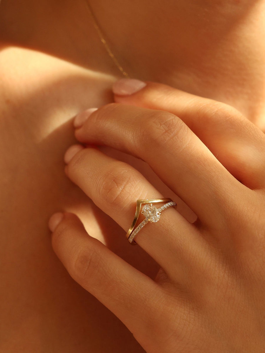 Oval cut lab grown diamond pavé engagement ring, 0.50 to 1.50 carats, with side stones in elegant prong setting on gold band