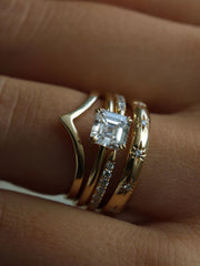 1.20 carat Asscher cut lab grown diamond solitaire engagement ring set in a classic prong design on polished gold band