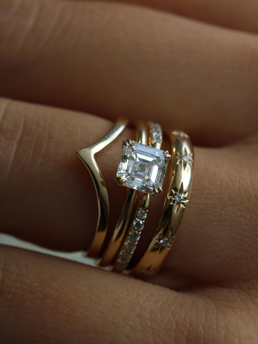 1.20 carat Asscher cut lab grown diamond solitaire engagement ring set in a classic prong design on polished gold band