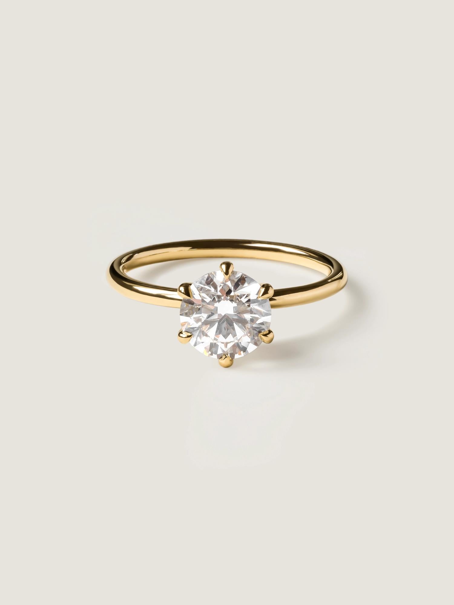 Round cut lab grown diamond solitaire engagement ring, 1.50 to 3.50 carats, set in timeless prong design on polished gold band